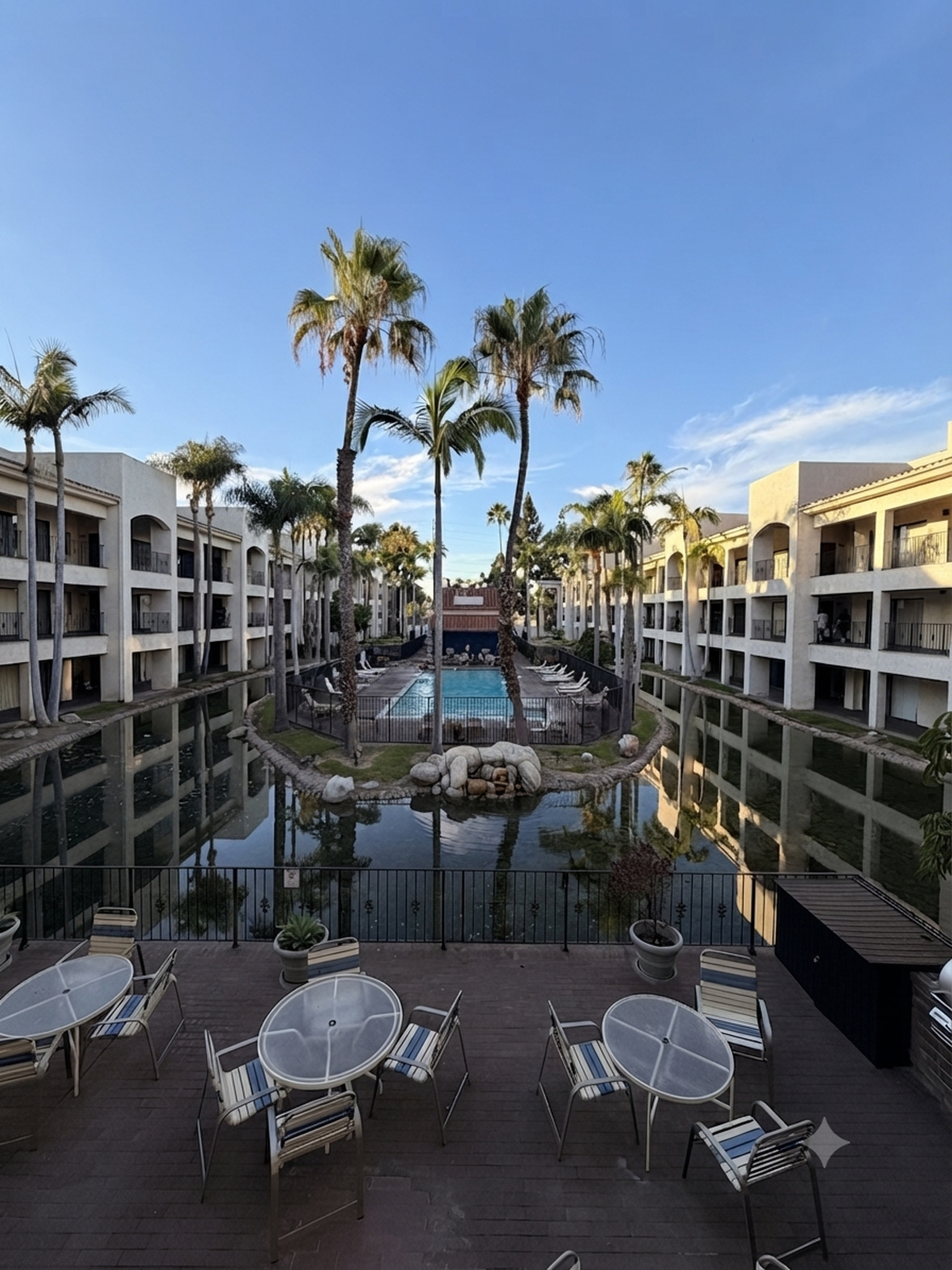 Resort-style courtyard and pool, view from the balcony